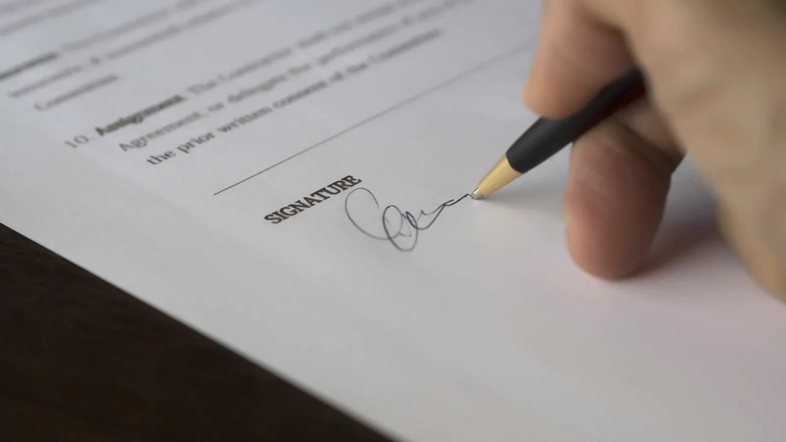 Man signing contract