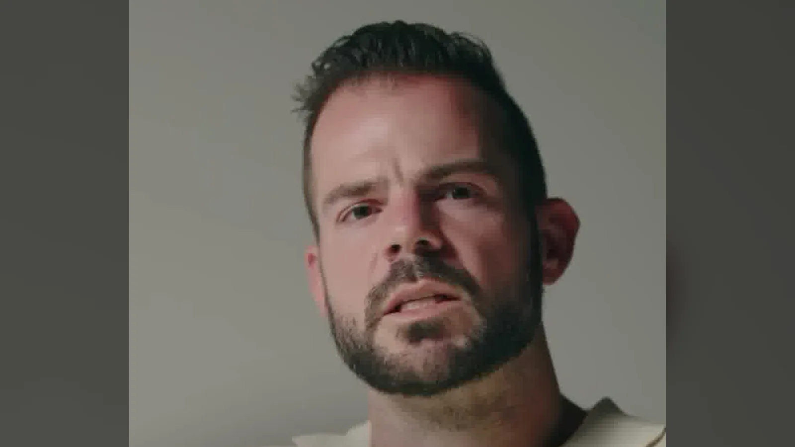 Cole Gordon, founder of Closers.io, speaking into a podcast microphone in one of his Instagram reels.