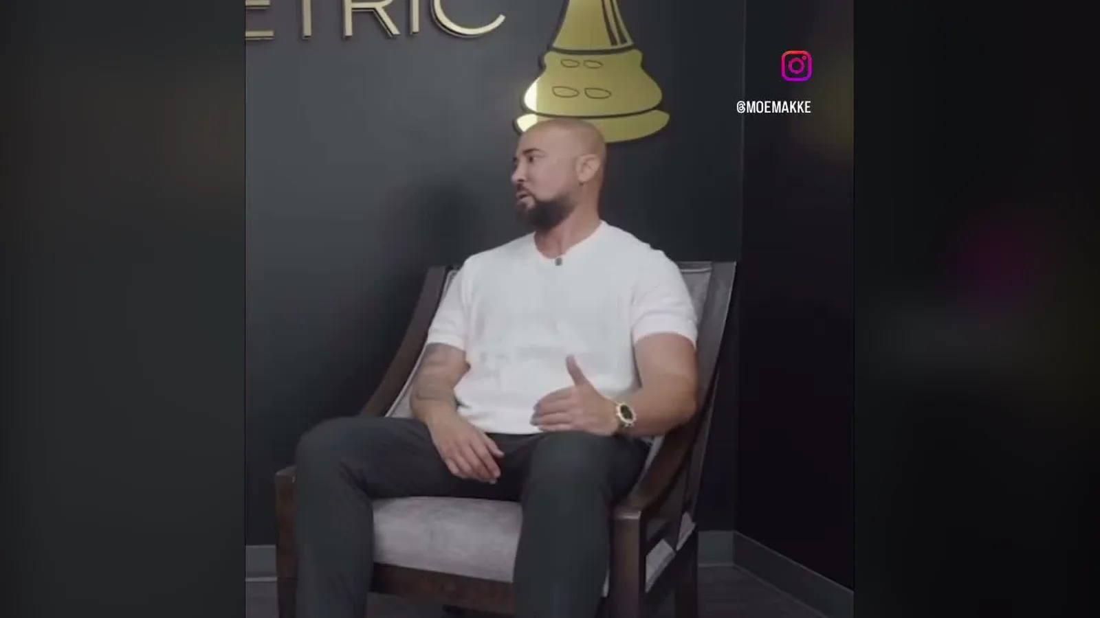 Moe Makke seated in his office in front of a gold chess-piece logo during a TikTok interview clip.